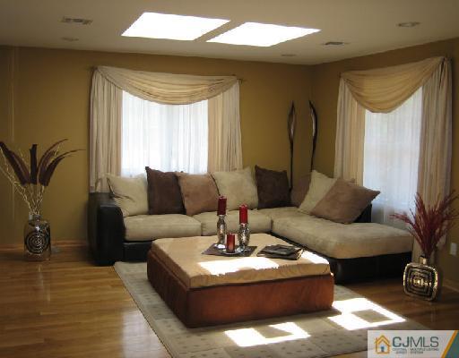 34 Kimberly Road Colonia, NJ 07067 - Photo 3 of 8 a living room with furniture and a large window