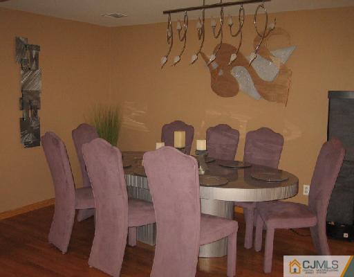 34 Kimberly Road Colonia, NJ 07067 - Photo 5 of 8 a view of a dining room with furniture and wooden floor