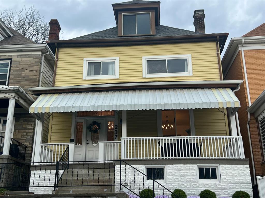 237 Lelia Street Pittsburgh, PA 15211 - Photo 45 of 46 a front view of a house with a porch