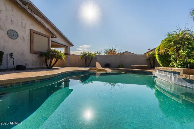 a view of swimming pool with a yard