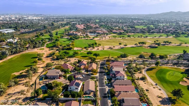 an aerial view of residential houses with outdoor space
