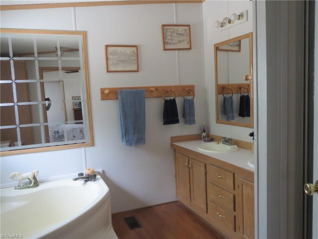 123 Industrial Road Elkin, NC 28621 - Photo 12 of 27 Master bath with garden tub and stand-along shower.
