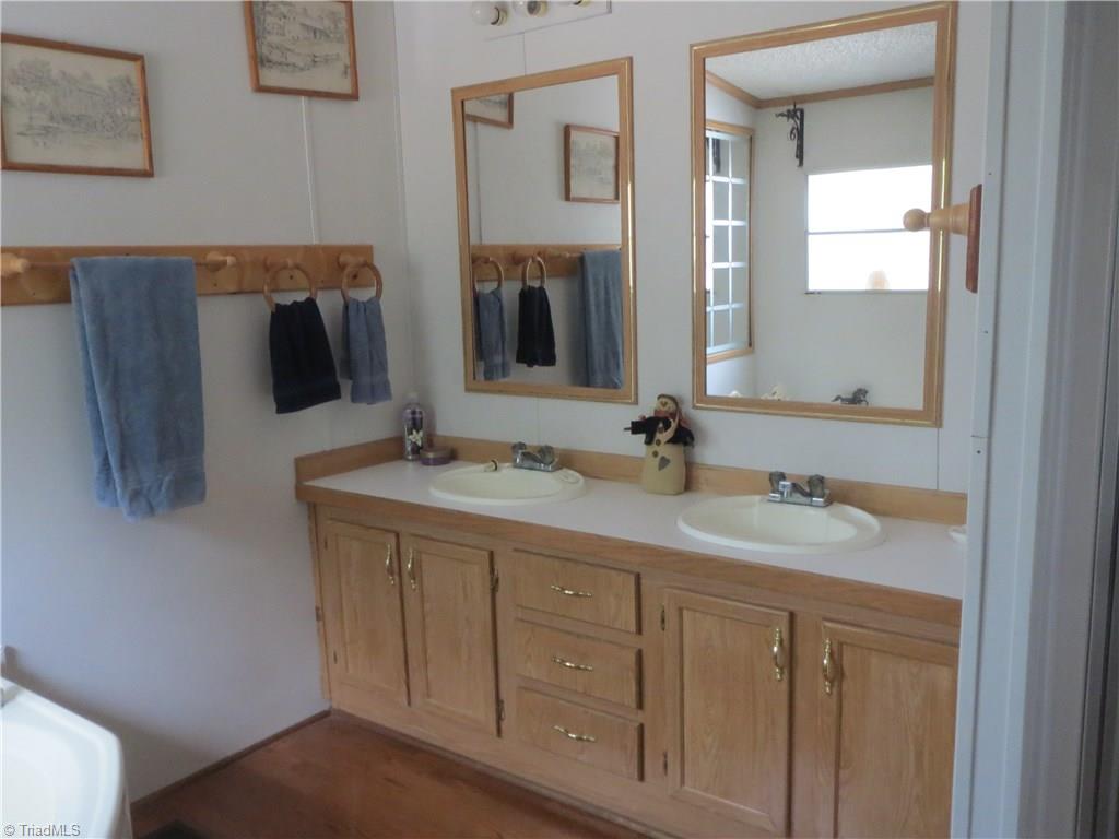 123 Industrial Road Elkin, NC 28621 - Photo 14 of 27 Master bath features double vanity.