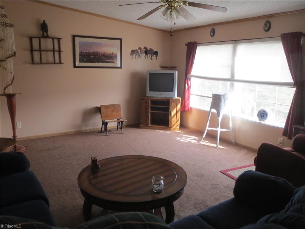 123 Industrial Road Elkin, NC 28621 - Photo 9 of 27 Living room with double windows looking out onto 1+ acre.