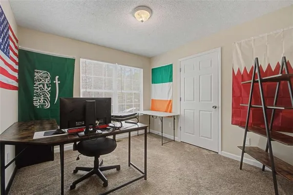 a view of a workspace with furniture