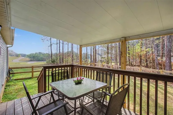 a view of a two chairs and table in the balcony