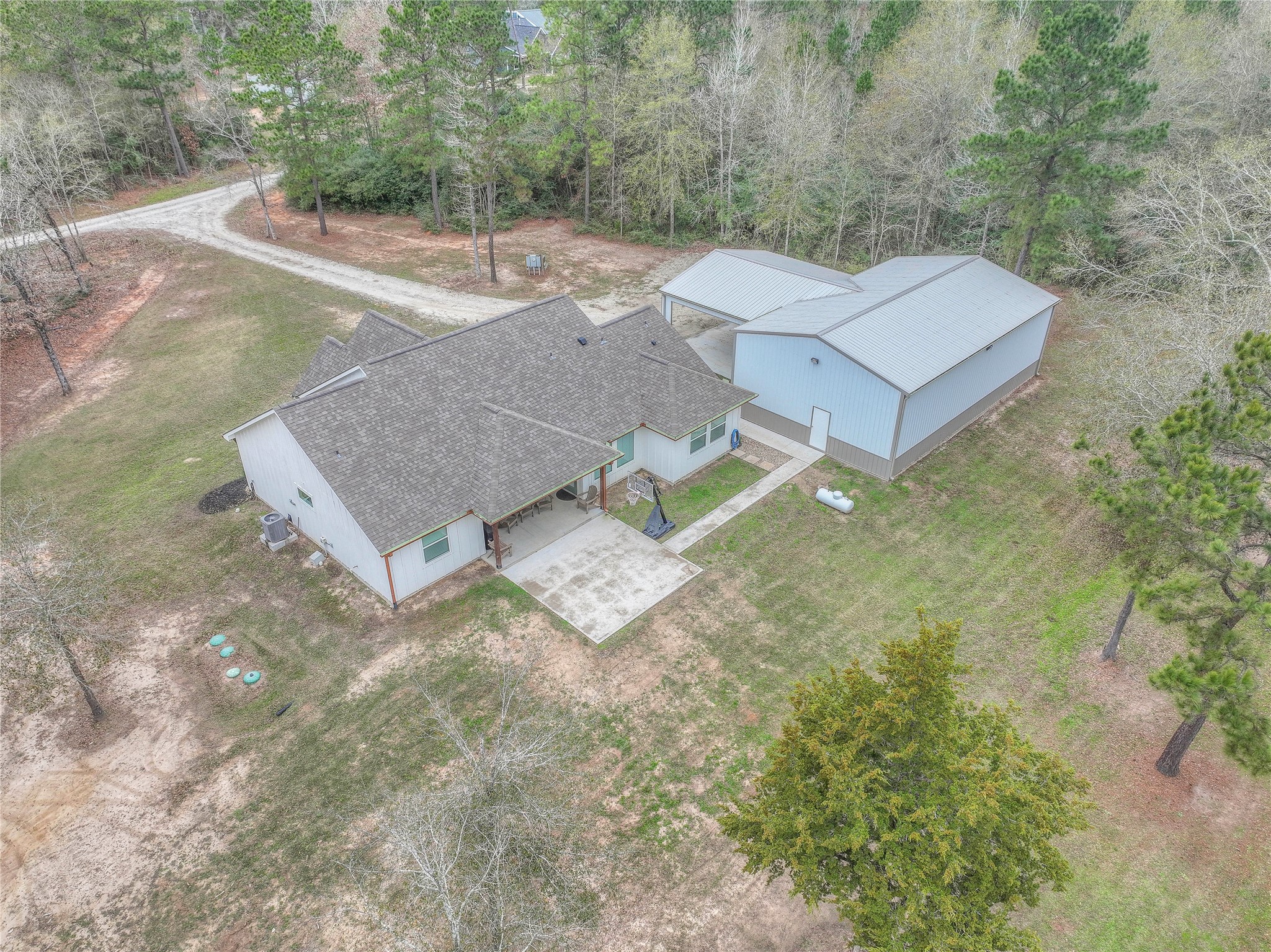 786 Farm To Market 230, Unit C Trinity, TX 75862 - Photo 36 of 41 an aerial view of a house with yard and trees