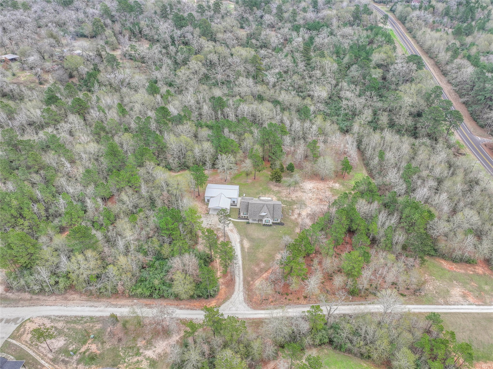 786 Farm To Market 230, Unit C Trinity, TX 75862 - Photo 38 of 41 a aerial view of a house with a yard and large tree