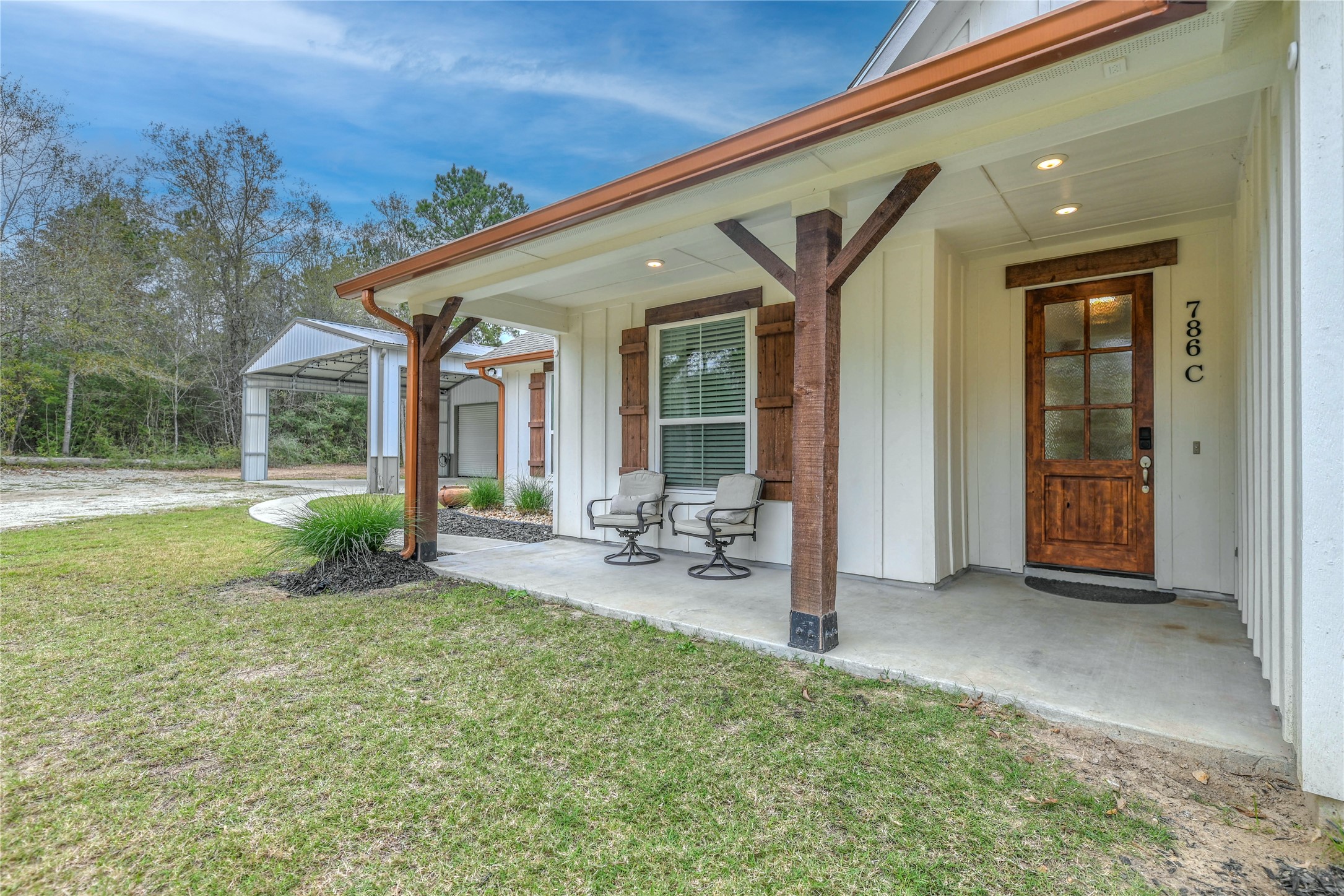 786 Farm To Market 230, Unit C Trinity, TX 75862 - Photo 41 of 41 a view of a house with backyard porch and sitting area