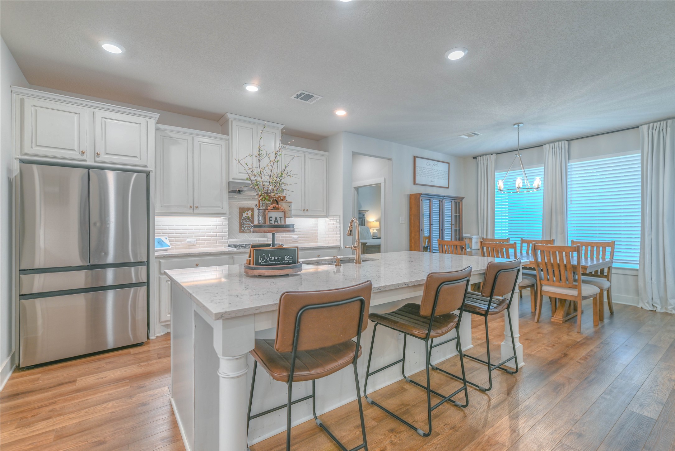 786 Farm To Market 230, Unit C Trinity, TX 75862 - Photo 8 of 41 a kitchen with stainless steel appliances granite countertop a dining table chairs refrigerator and cabinets