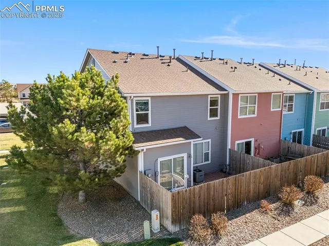 an aerial view of a house with a garden