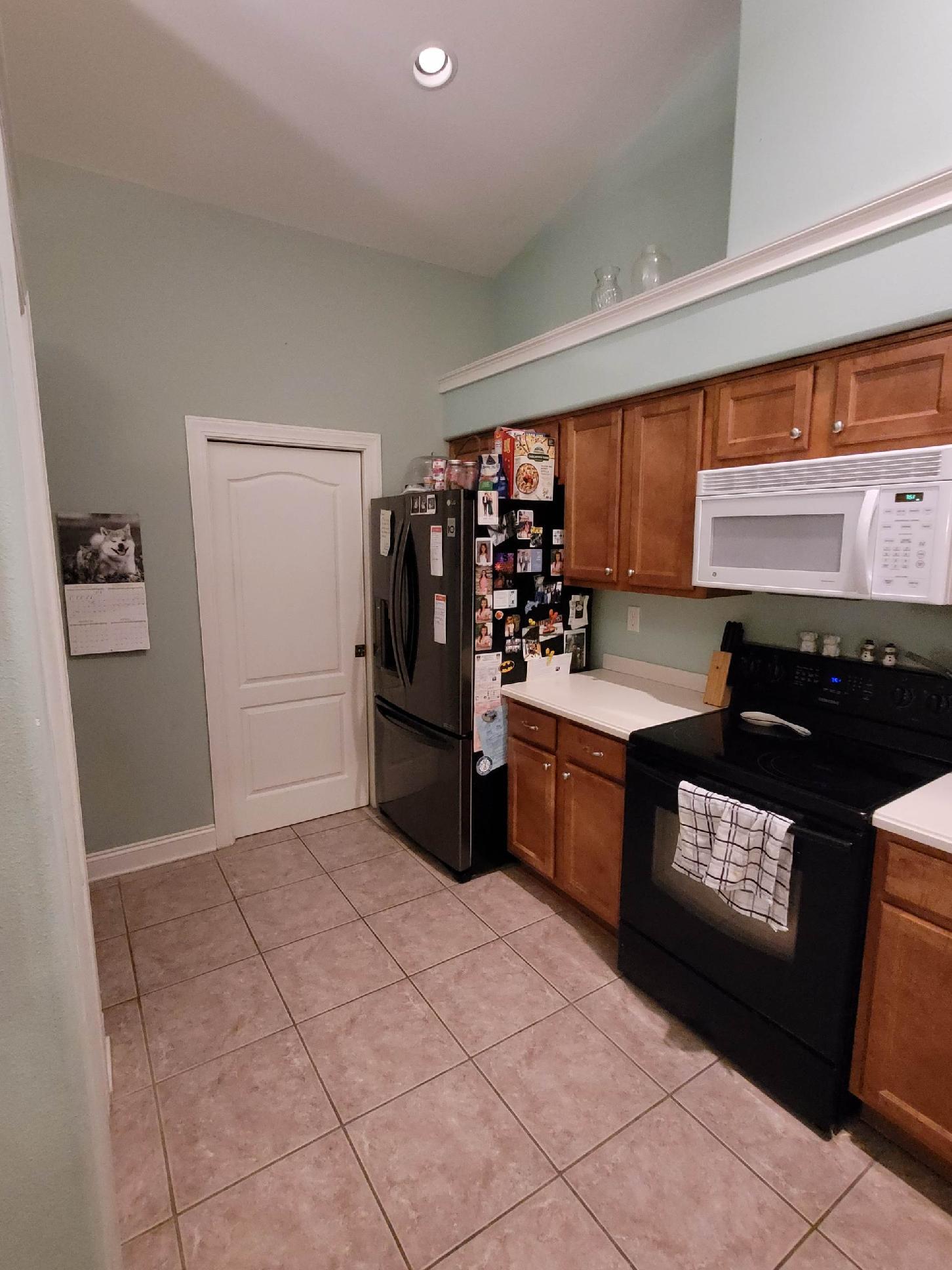 4210 Jade Loop Destin, FL 32541 - Photo 2 of 9 a kitchen with stainless steel appliances granite countertop a stove a sink and a refrigerator