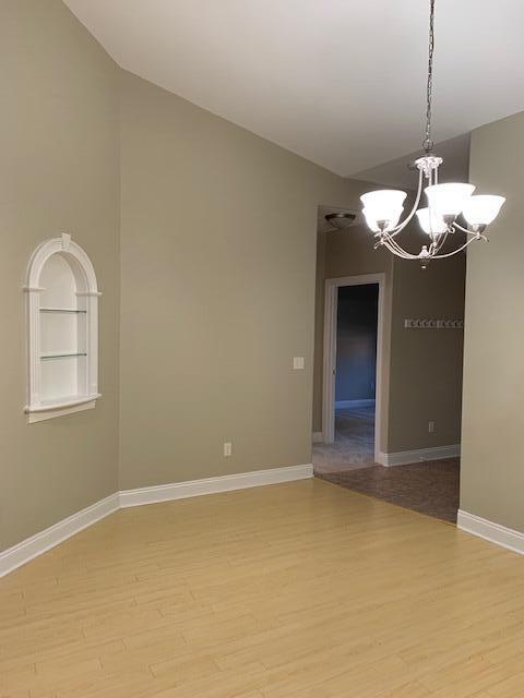 4210 Jade Loop Destin, FL 32541 - Photo 9 of 9 a view of a kitchen with a sink and chandelier