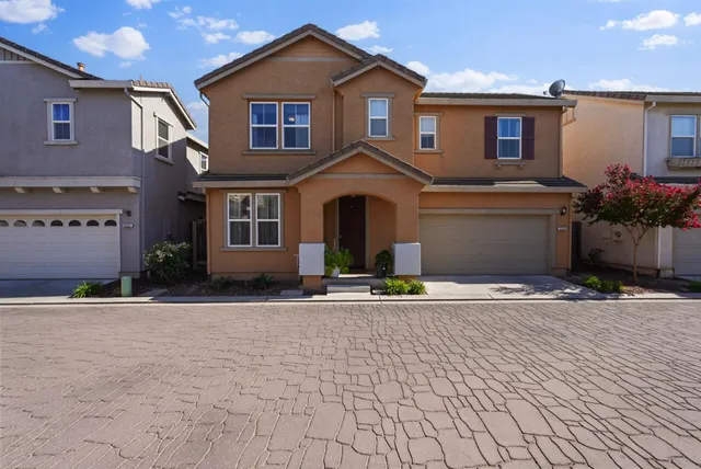 a front view of a house with yard