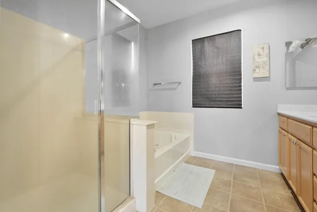 a bathroom with a bathtub and shower