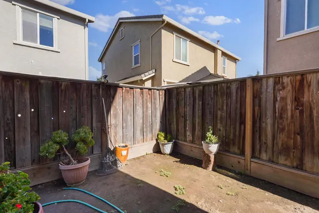 a view of two chairs in the patio