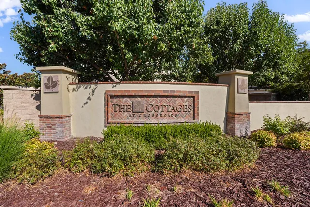 a view of a sign in front of house