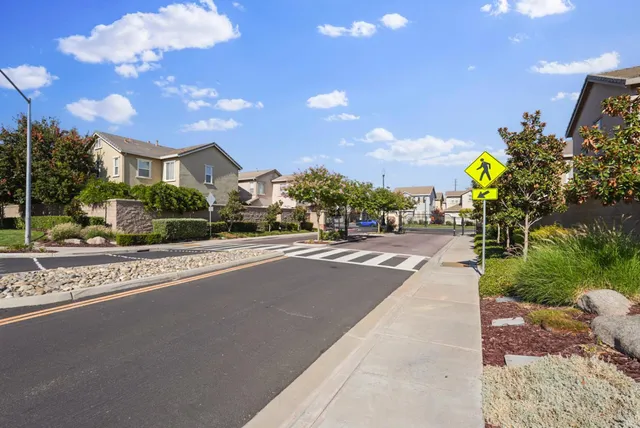a view of a street with a building in the background