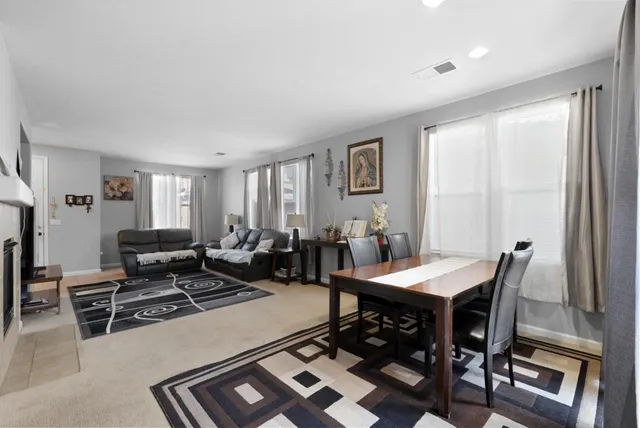 a view of a dining room with furniture