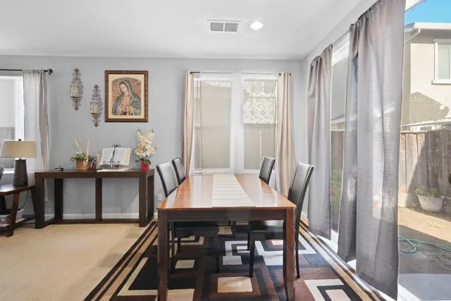 a dining room with furniture and window