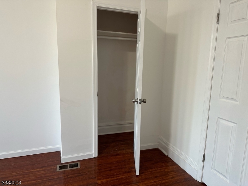 247 South 8th Street, Unit 1 Newark, NJ 07103 - Photo 13 of 13 a view of empty room with wooden floor