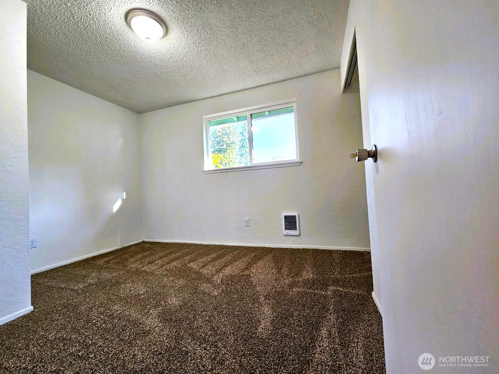 8927 178th Avenue Southwest Rochester, WA 98579 - Photo 24 of 38 an empty room with windows
