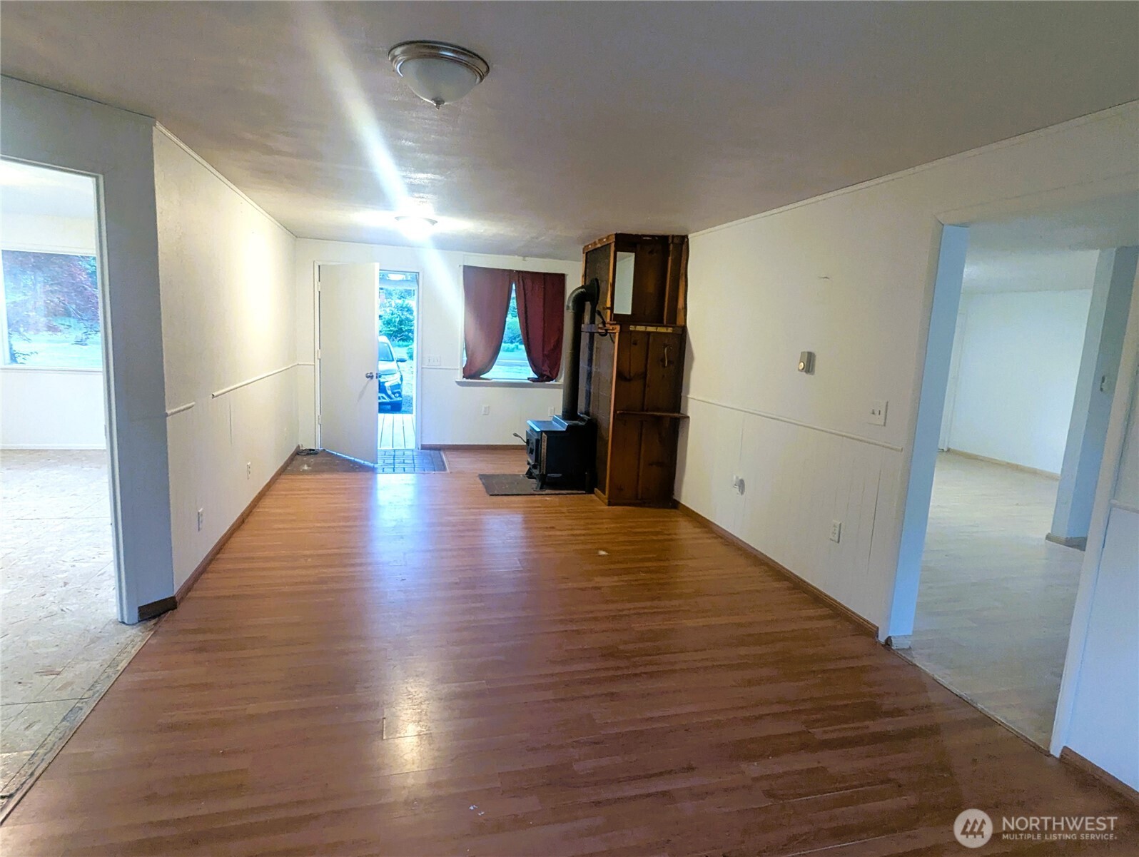 8927 178th Avenue Southwest Rochester, WA 98579 - Photo 28 of 38 a view of a hallway with wooden floor