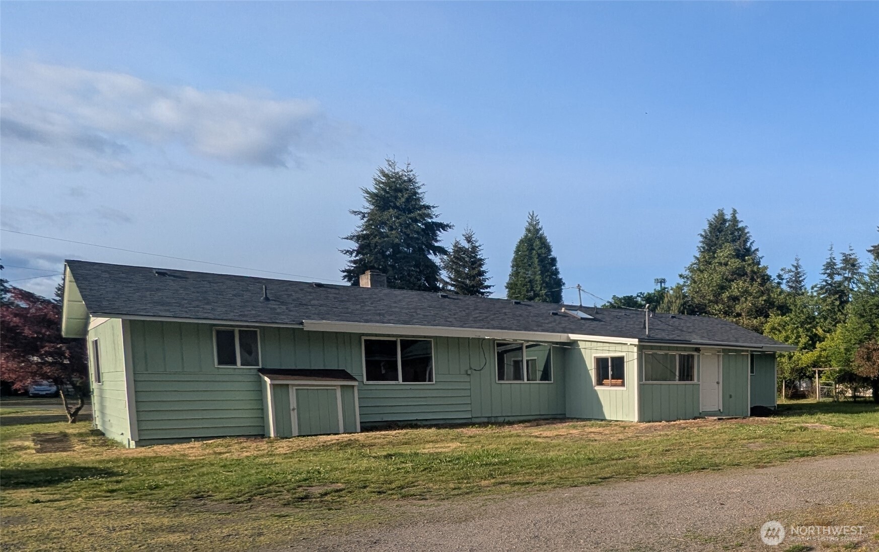 8927 178th Avenue Southwest Rochester, WA 98579 - Photo 3 of 38 a house that has a tree in front of it