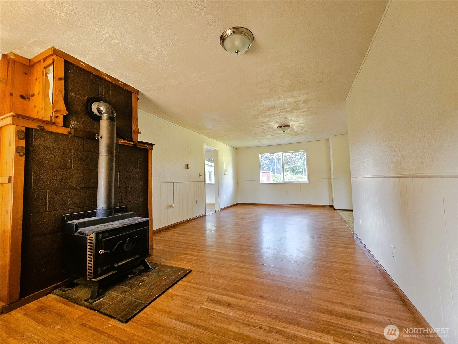 8927 178th Avenue Southwest Rochester, WA 98579 - Photo 32 of 38 a view of a livingroom with wooden floor