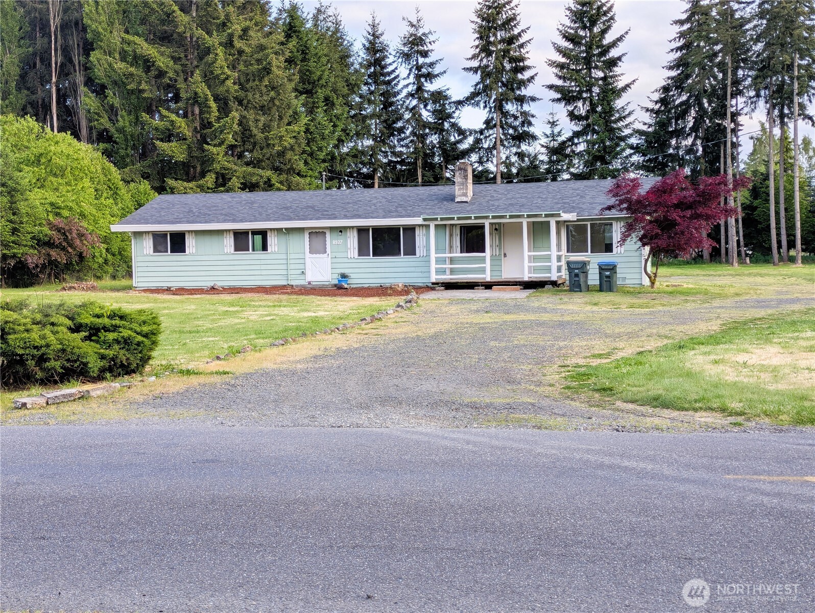 8927 178th Avenue Southwest Rochester, WA 98579 - Photo 38 of 38 a front view of a house with a garden and trees