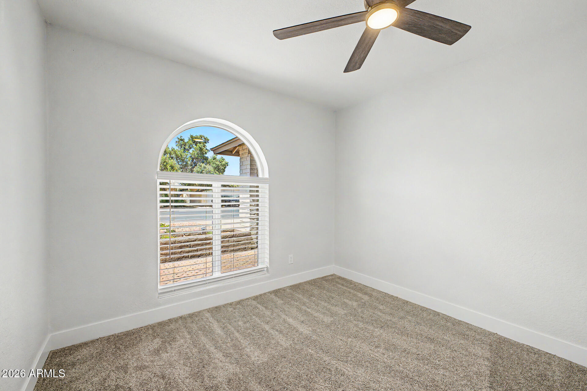 1009 West Pampa Avenue Mesa, AZ 85210 - Photo 23 of 31 an empty room with a window