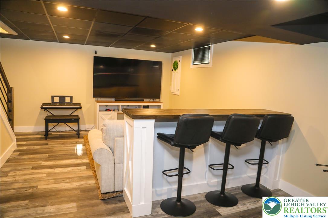 1412 Stanford Road Bethlehem, PA 18018 - Photo 48 of 58 A well-appointed recreation room features a stylish bar area, perfect for entertaining.