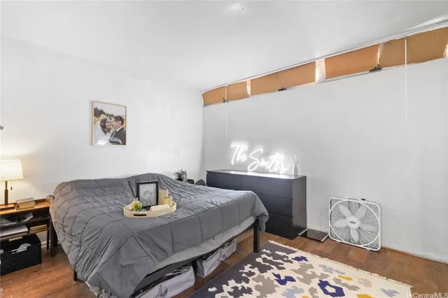 a view of a livingroom with workspace and a window