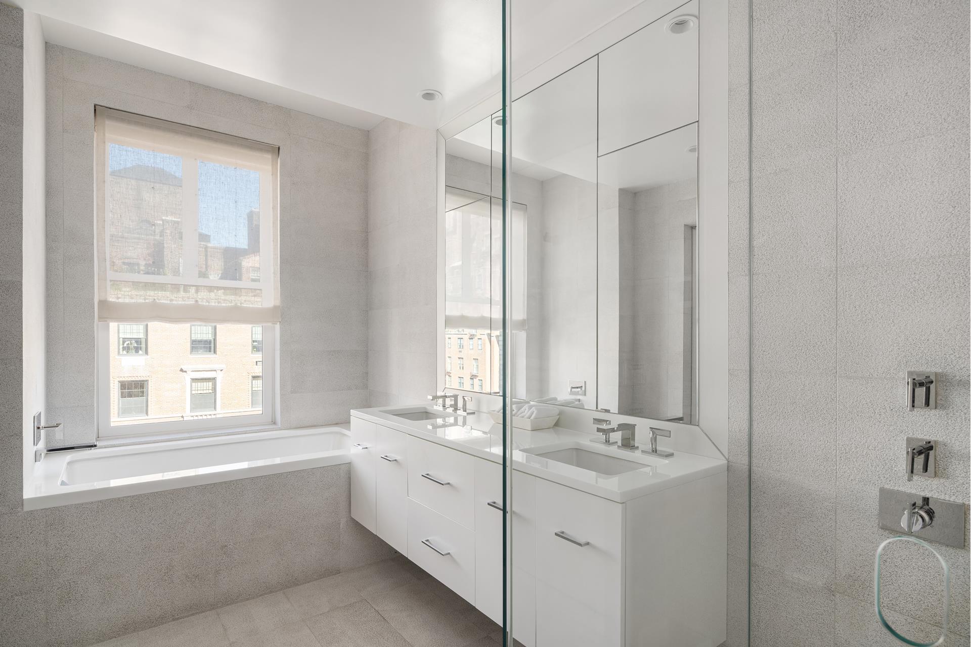 755 Park Avenue, Unit PHA Manhattan, NY 10021 - Photo 11 of 16 a bathroom with a double vanity sink a toilet and a tub
