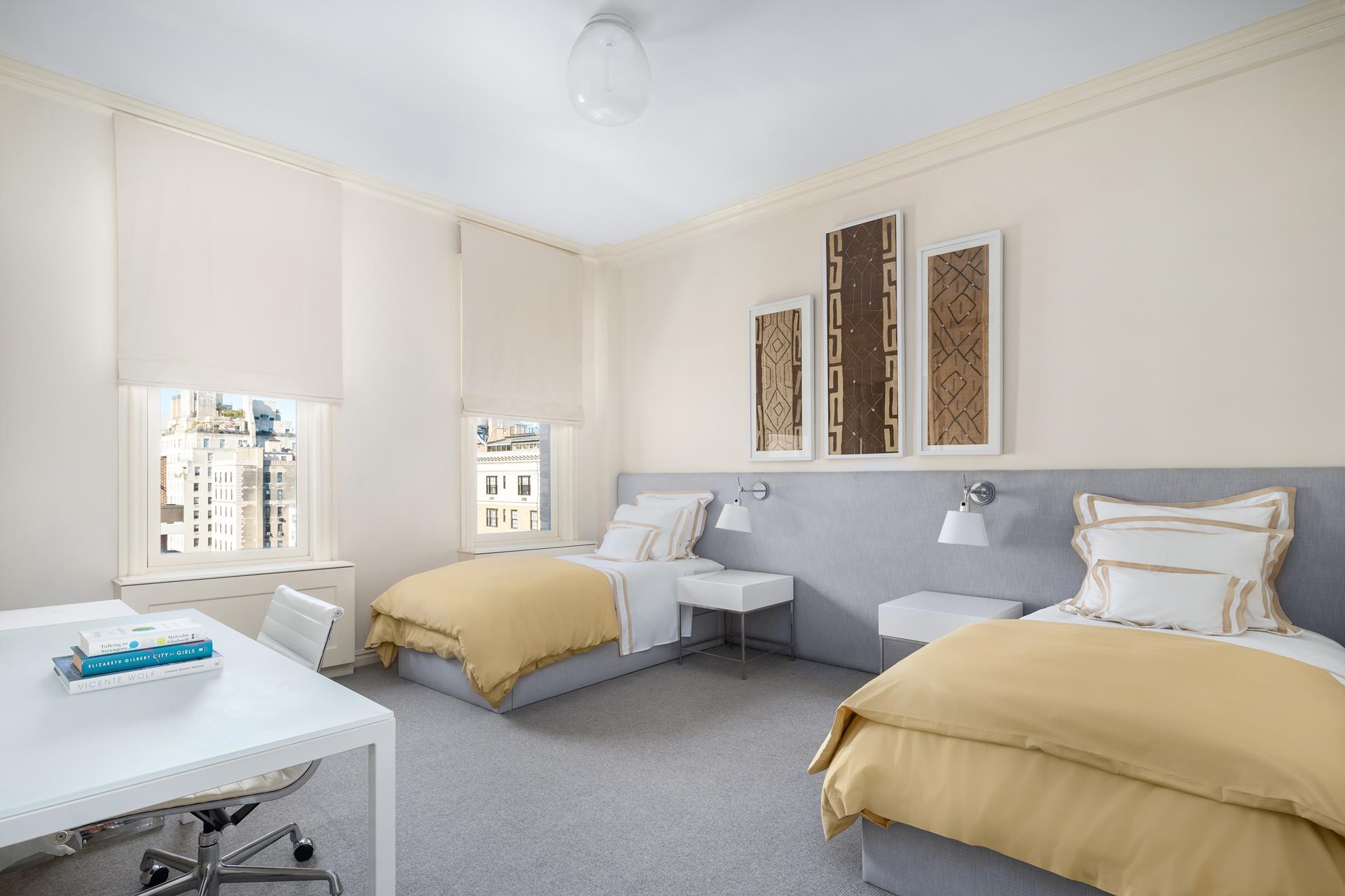 755 Park Avenue, Unit PHA Manhattan, NY 10021 - Photo 12 of 16 a bedroom with two beds and a table