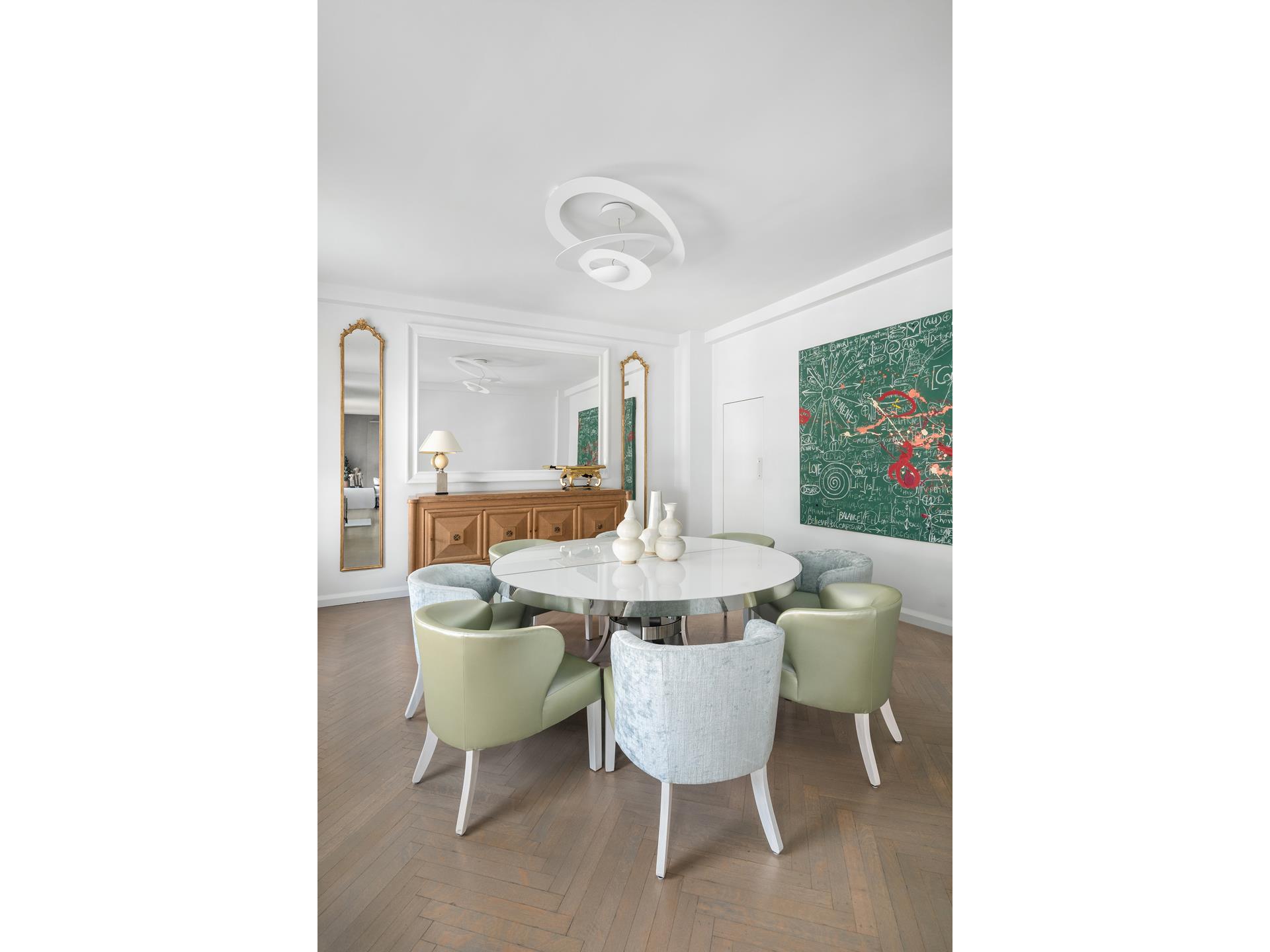 755 Park Avenue, Unit PHA Manhattan, NY 10021 - Photo 7 of 16 a dining room with a table and chairs