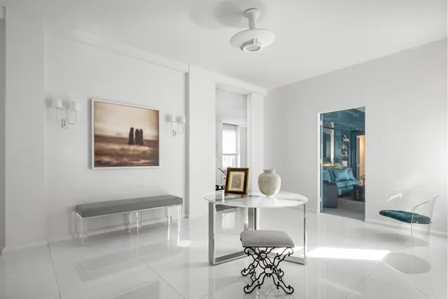 a dining room with a table and chairs