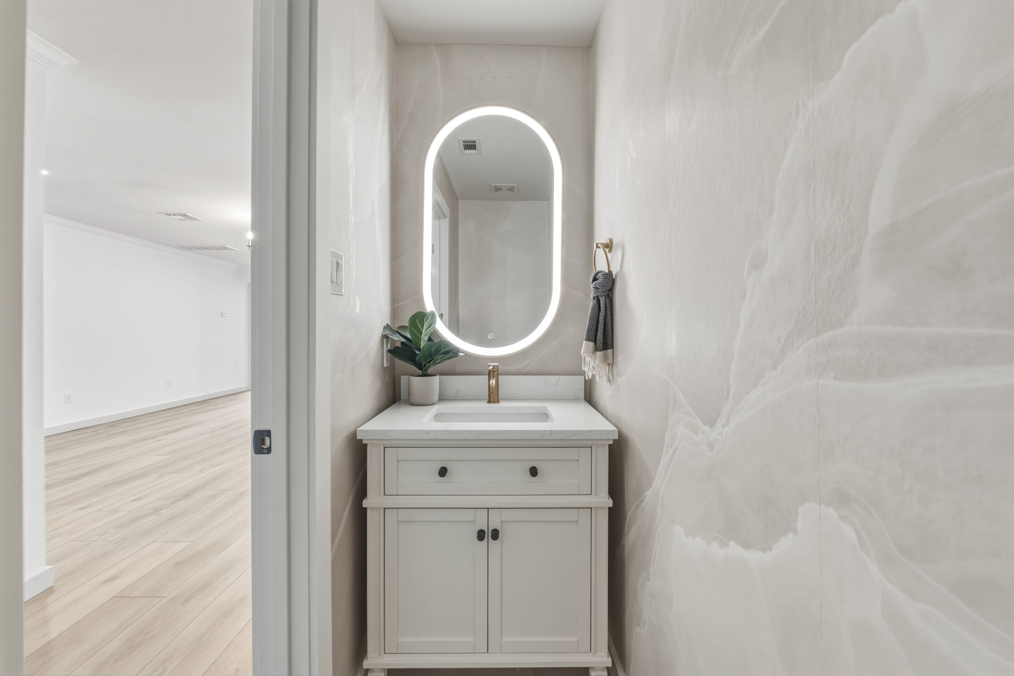 211 Banner Avenue Leander, TX 78641 - Photo 8 of 27 a bathroom with a sink and a mirror