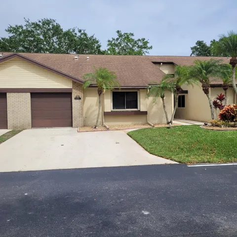 a house with yard in front of it