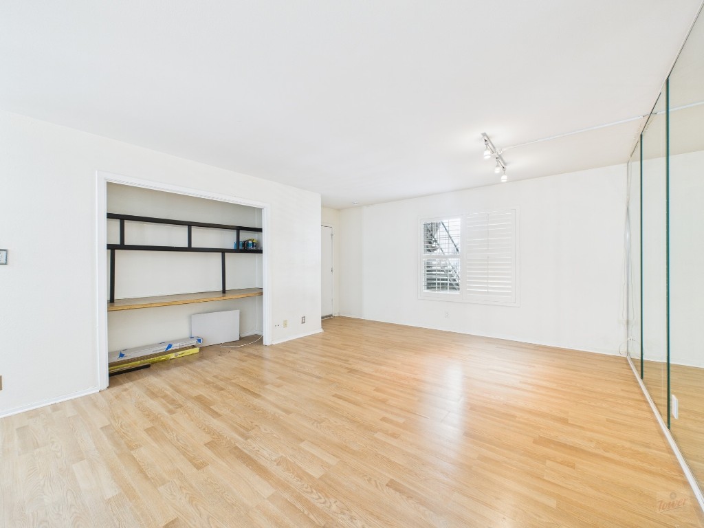 910 Duncan Lane, Unit 26 Austin, TX 78705 - Photo 12 of 31 a view of an empty room with a window