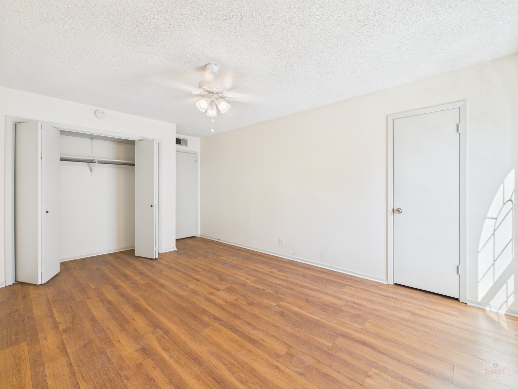 910 Duncan Lane, Unit 26 Austin, TX 78705 - Photo 26 of 31 a view of empty room with wooden floor
