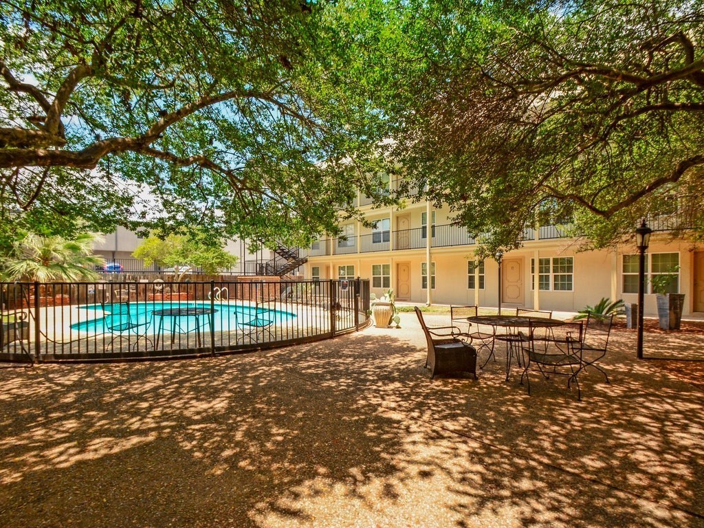 910 Duncan Lane, Unit 26 Austin, TX 78705 - Photo 29 of 31 a view of a house with backyard and sitting area