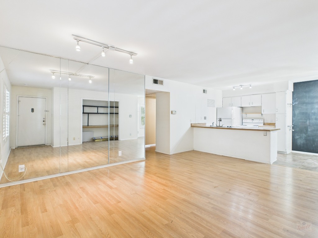 910 Duncan Lane, Unit 26 Austin, TX 78705 - Photo 4 of 31 a view of kitchen with wooden floor