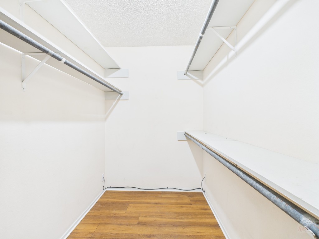 910 Duncan Lane, Unit 26 Austin, TX 78705 - Photo 5 of 31 a view of a room with racks on the wall