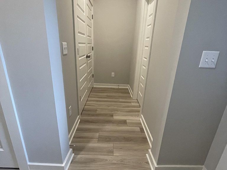 702 Mickelson Way, Unit 702 Lebanon, TN 37087 - Photo 14 of 17 a view of a hallway with wooden floor and entryway