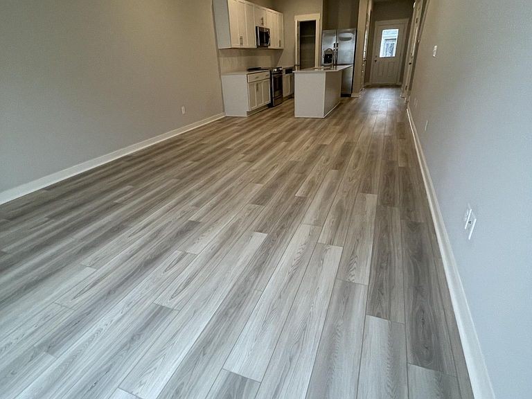 702 Mickelson Way, Unit 702 Lebanon, TN 37087 - Photo 3 of 17 a view of a kitchen with wooden floor