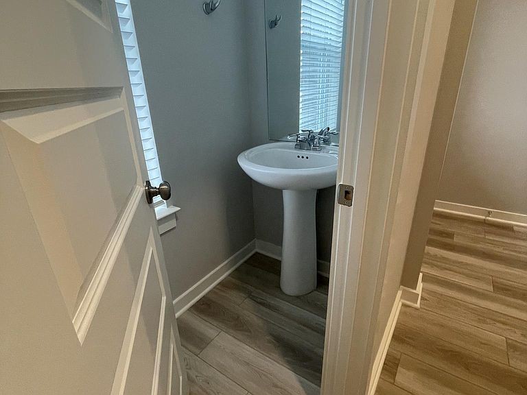 702 Mickelson Way, Unit 702 Lebanon, TN 37087 - Photo 8 of 17 a bathroom with a sink a mirror and shower