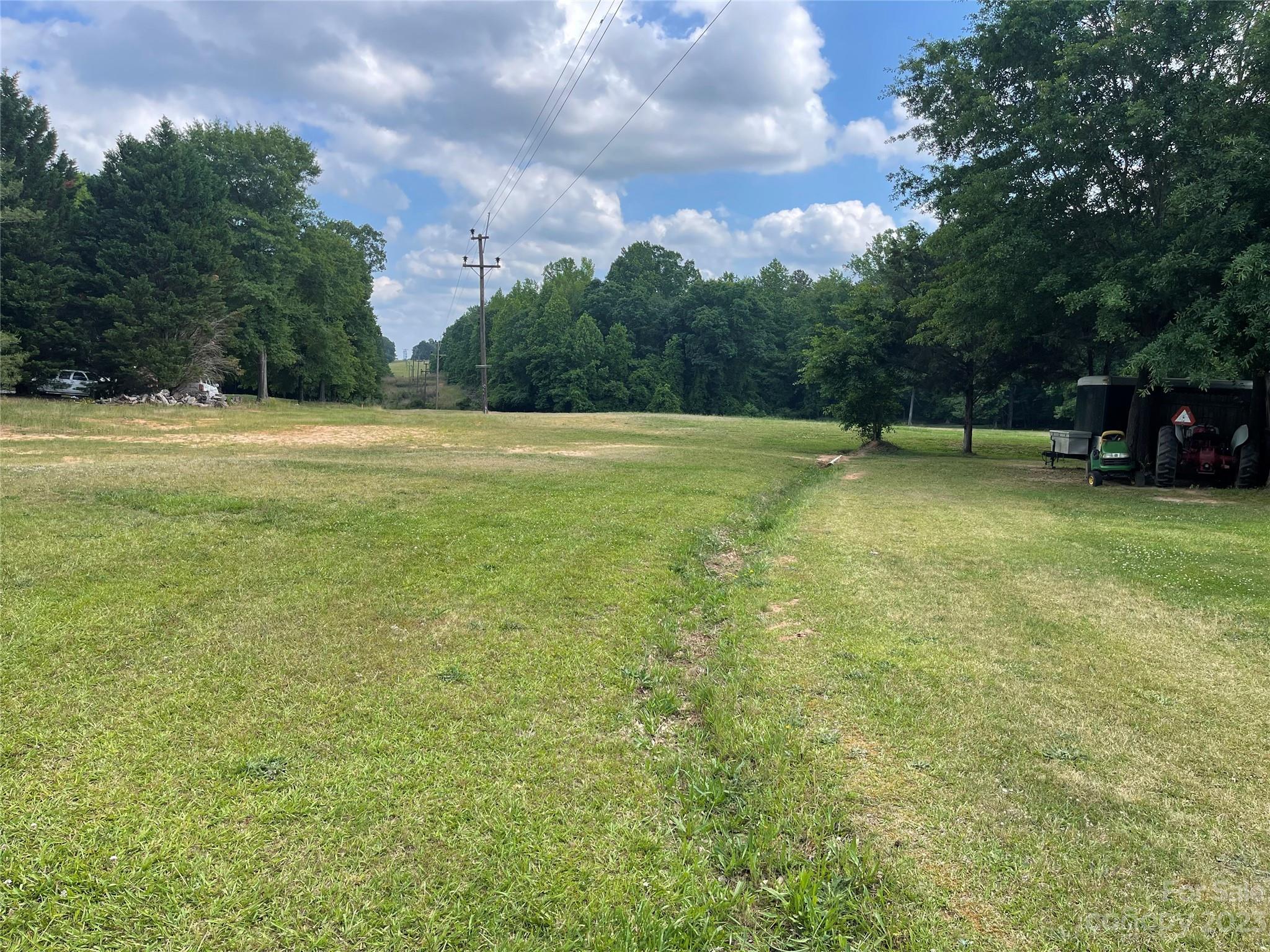 1375 Williams Road Fort Mill, SC 29715 - Photo 1 of 13 a view of a swimming pool and trees in the background