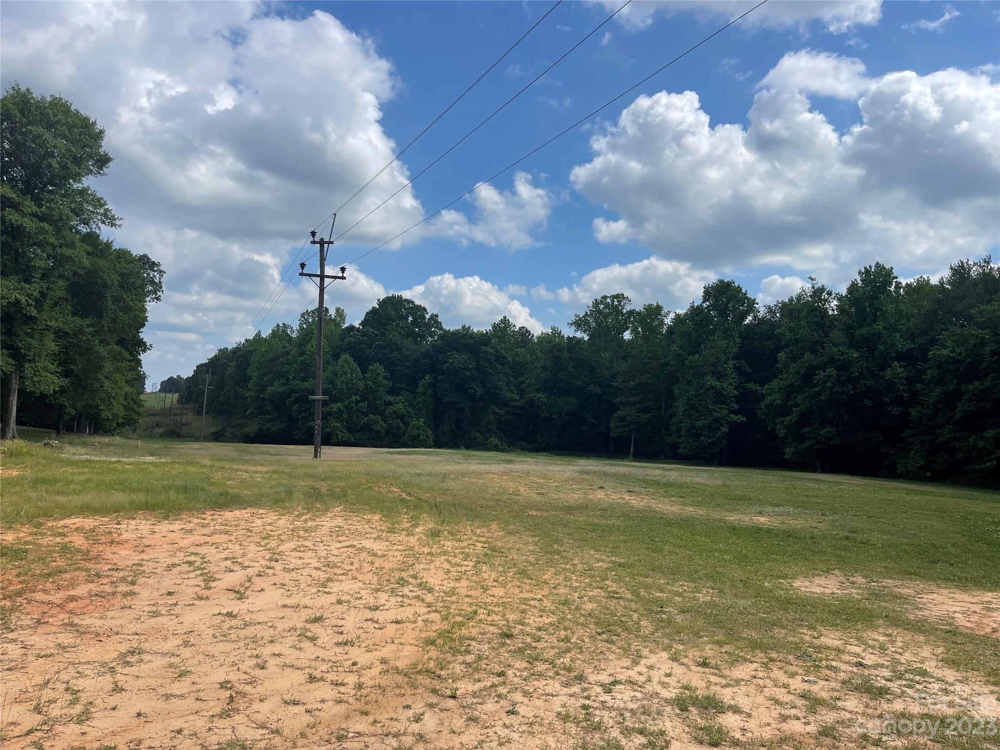 1375 Williams Road Fort Mill, SC 29715 - Photo 2 of 13 a view of a field with an trees in front of it