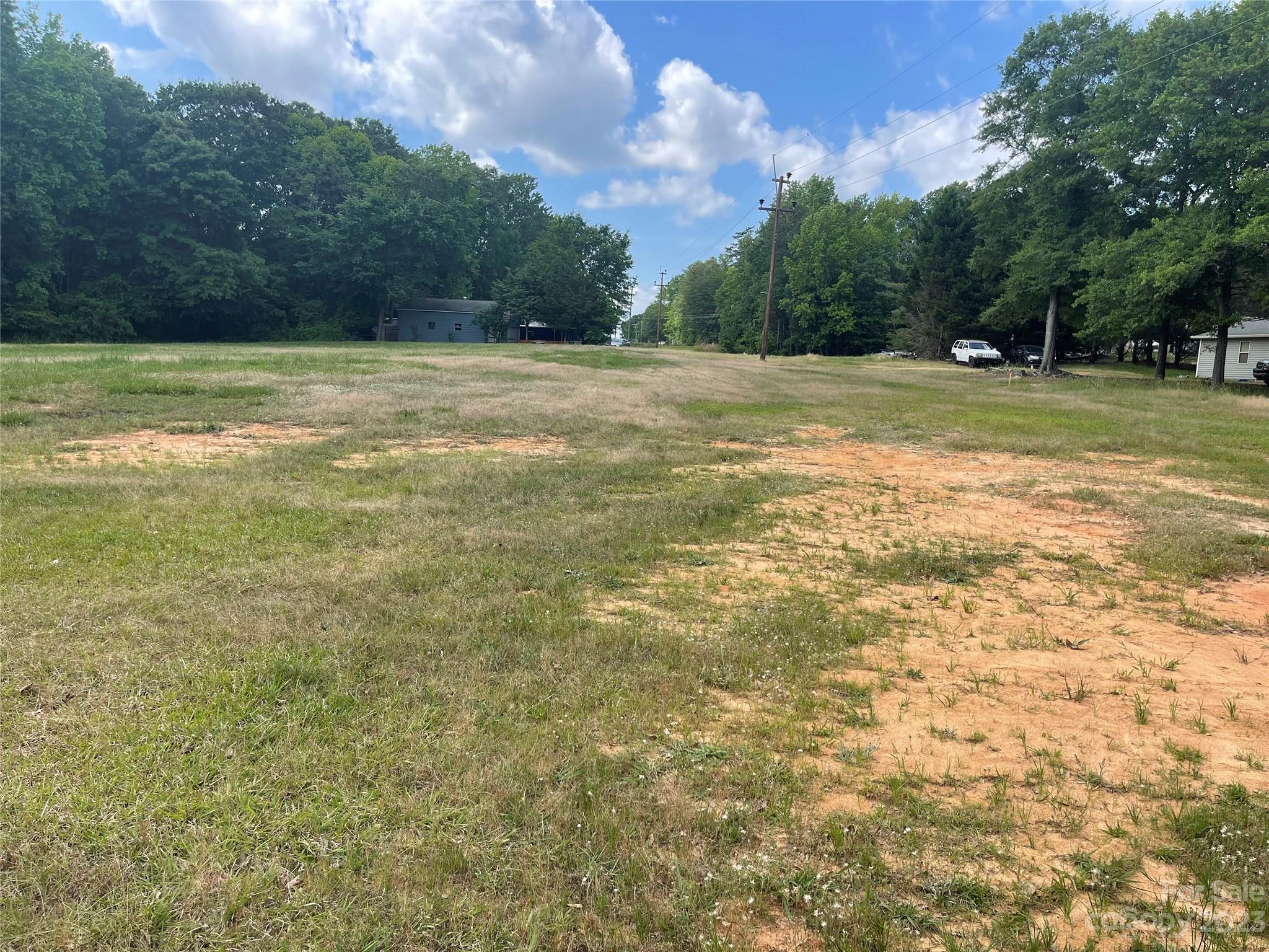 1375 Williams Road Fort Mill, SC 29715 - Photo 6 of 13 a view of a field with an trees in the background